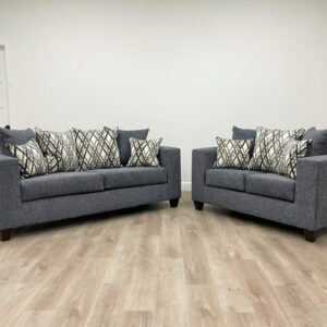 Modern steel gray sofa and loveseat set with textured fabric and geometric accent pillows