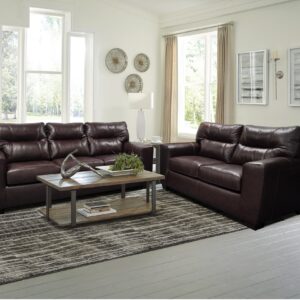 2043 Soft Touch Chestnut sofa and loveseat set with rich brown leather-look upholstery, plush cushions, and a warm, inviting living room setup