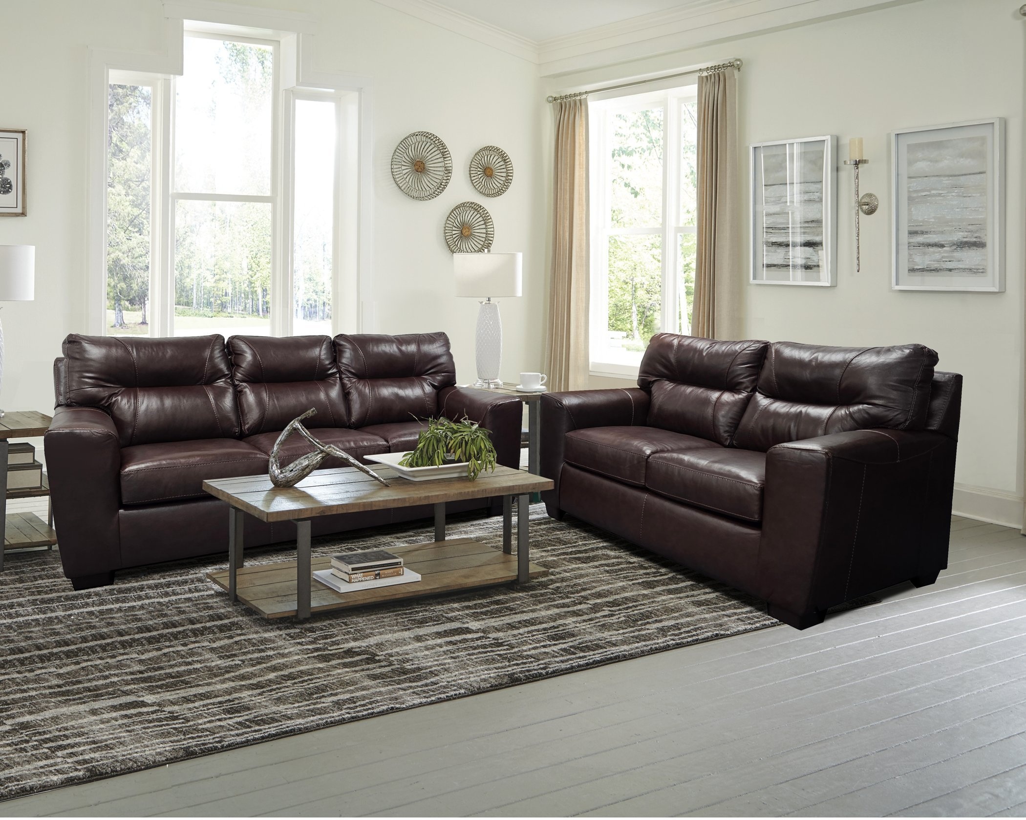2043 Soft Touch Chestnut sofa and loveseat set with rich brown leather-look upholstery, plush cushions, and a warm, inviting living room setup