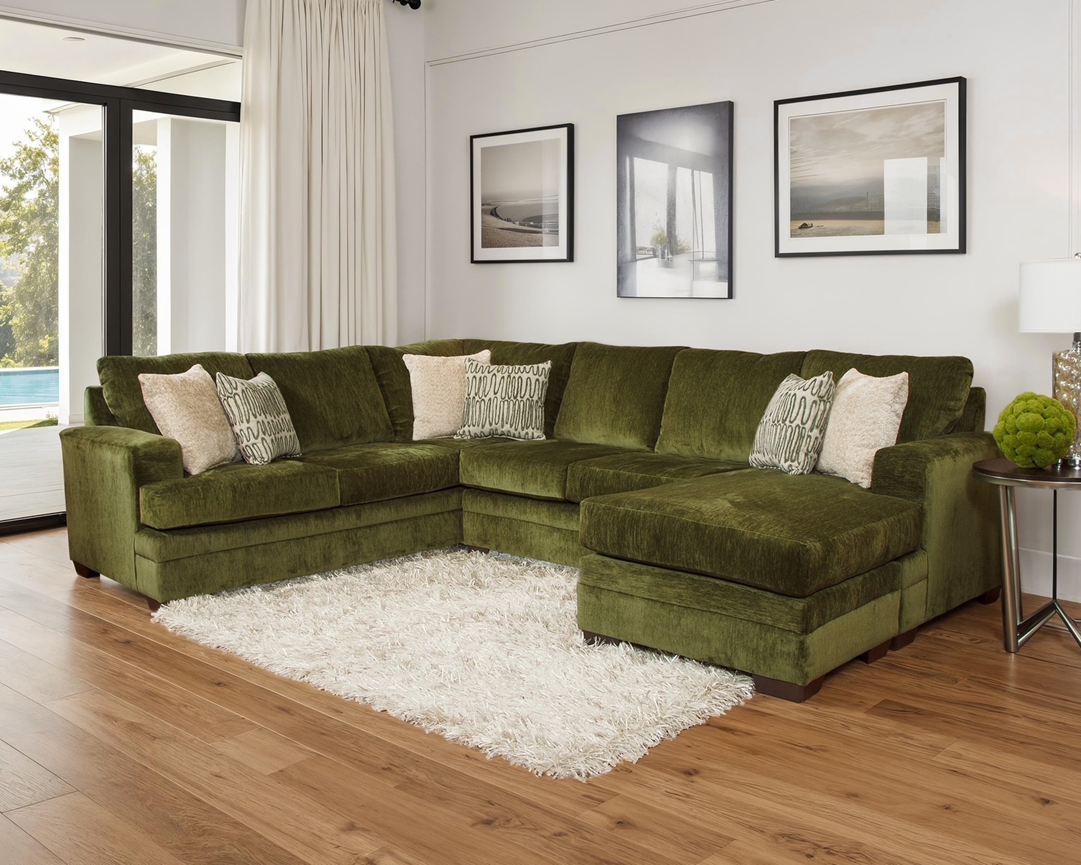 Green Mandy Chive sectional sofa with chaise and decorative pillows in modern living room