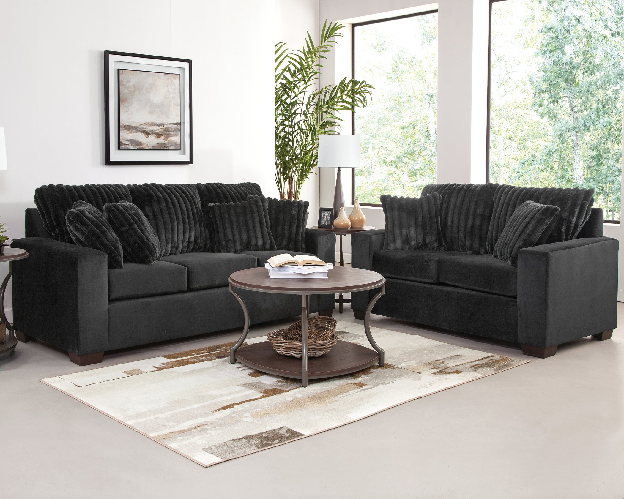 2900 Implosion Black sofa and loveseat set with soft plush corduroy-style upholstery and deep seating in a modern living room