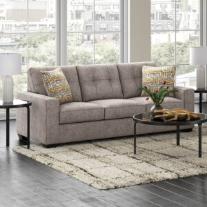 Modern beige queen sleeper sofa with tufted back cushions and accent pillows in contemporary living room