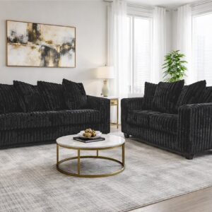 300 Hugo Black sofa and loveseat set with soft black upholstery, channel-tufted design, and modern low-profile silhouette in a bright living room