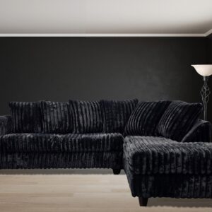 black corduroy sectional sofa with chaise and plush cushions in modern living room