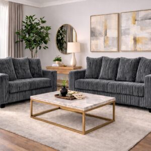 300 Hugo Grey sofa and loveseat set with soft ivory upholstery, channel-tufted design, and modern low-profile silhouette in a bright living room