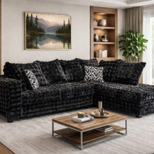 black textured sectional sofa with chaise and accent pillows in modern living room