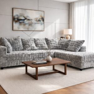 grey textured sectional sofa with chaise and plush cushions in modern living room