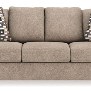 Neutral brown queen sofa sleeper with patterned accent pillows and plush cushions