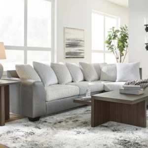 Large modern gray sectional sofa with soft corded cushions and matching wood accent tables