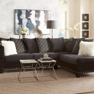 2019 Black Combo sectional with chaise, black upholstery, patterned back cushions, and nailhead trim in a modern living room