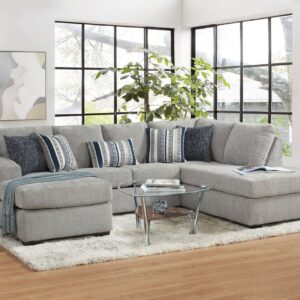 4550 Platinum sectional with chaise, light gray upholstery, plush cushions, and modern L-shaped design in a bright living room