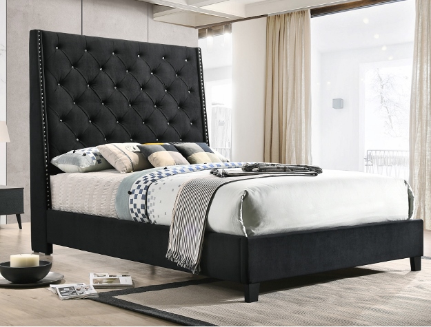 Black tufted upholstered bed frame with tall button-tufted headboard in modern luxury bedroom