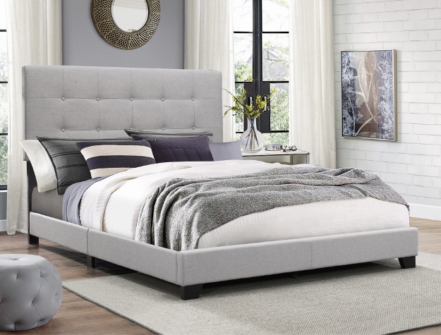 Light gray upholstered platform bed frame with modern clean design in contemporary bedroom