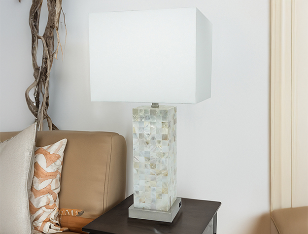 Modern table lamp with square white shade and textured geometric base