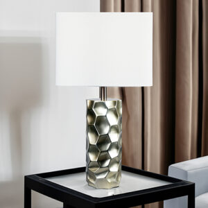 Modern silver table lamp with textured geometric base and white shade
