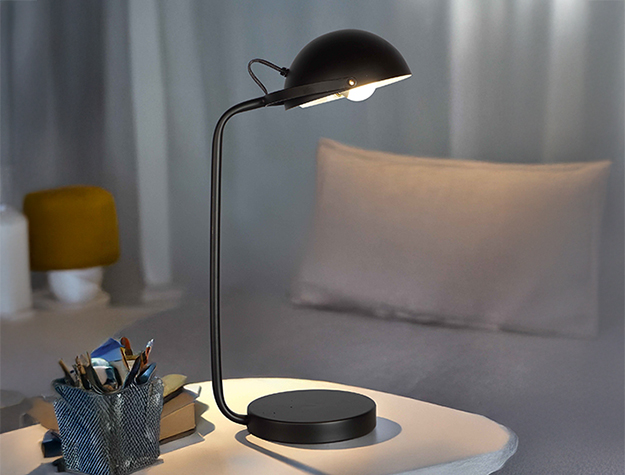 Modern black desk table lamp with curved arm and dome shade