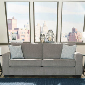 Light gray queen sleeper sofa with accent pillows in a modern living room