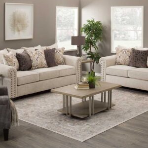 9175 Della Linen sofa and loveseat set with light fabric upholstery, nailhead trim, and decorative accent pillows