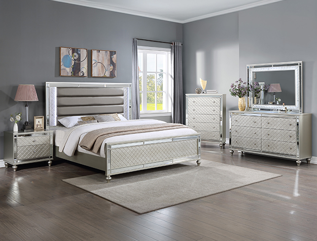 Cristian 7-piece queen/king bedroom set with upholstered headboard, dresser, mirror, chest, and nightstand in a light metallic silver finish.