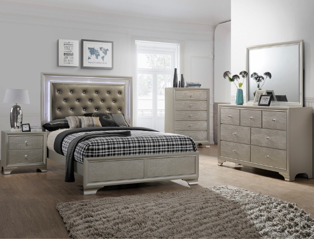 Lyssa 7-piece bedroom set with upholstered bed, dresser, mirror, chest, and nightstand in a light champagne finish with glam accents.