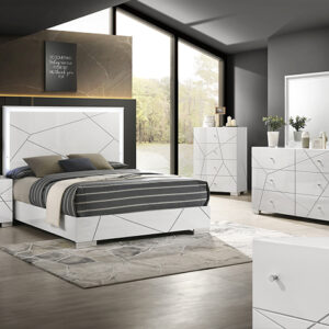 Ayla 7-piece bedroom set with modern panel bed, dresser, mirror, chest, and nightstand in a white finish with geometric line detailing.
