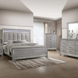 Vail 7-piece bedroom set with upholstered panel bed, dresser, mirror, chest, and nightstand in a gray wood finish with glam trim accents and modern styling.
