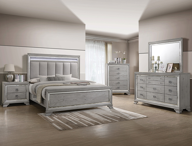Vail 7-piece bedroom set with upholstered panel bed, dresser, mirror, chest, and nightstand in a gray wood finish with glam trim accents and modern styling.
