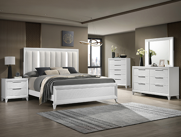 Cressida white 7-piece bedroom set with upholstered panel bed, dresser, mirror, chest, and nightstand in a white finish with modern clean lines and spacious storage.
