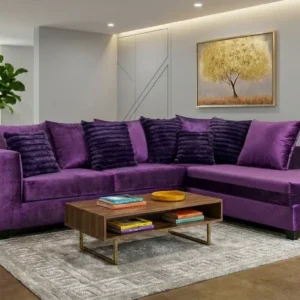 Modern purple sectional sofa with chaise lounge and plush accent pillows