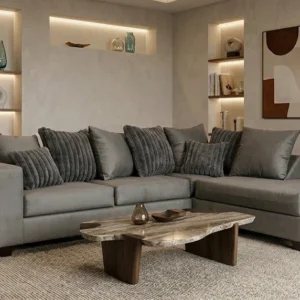 Modern charcoal gray sectional sofa with chaise lounge and plush accent pillows