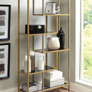 Modern gold metal open bookcase with black shelves and geometric design
