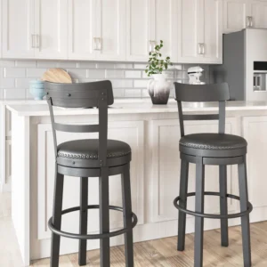 Black swivel bar height barstool with upholstered seat and nailhead trim
